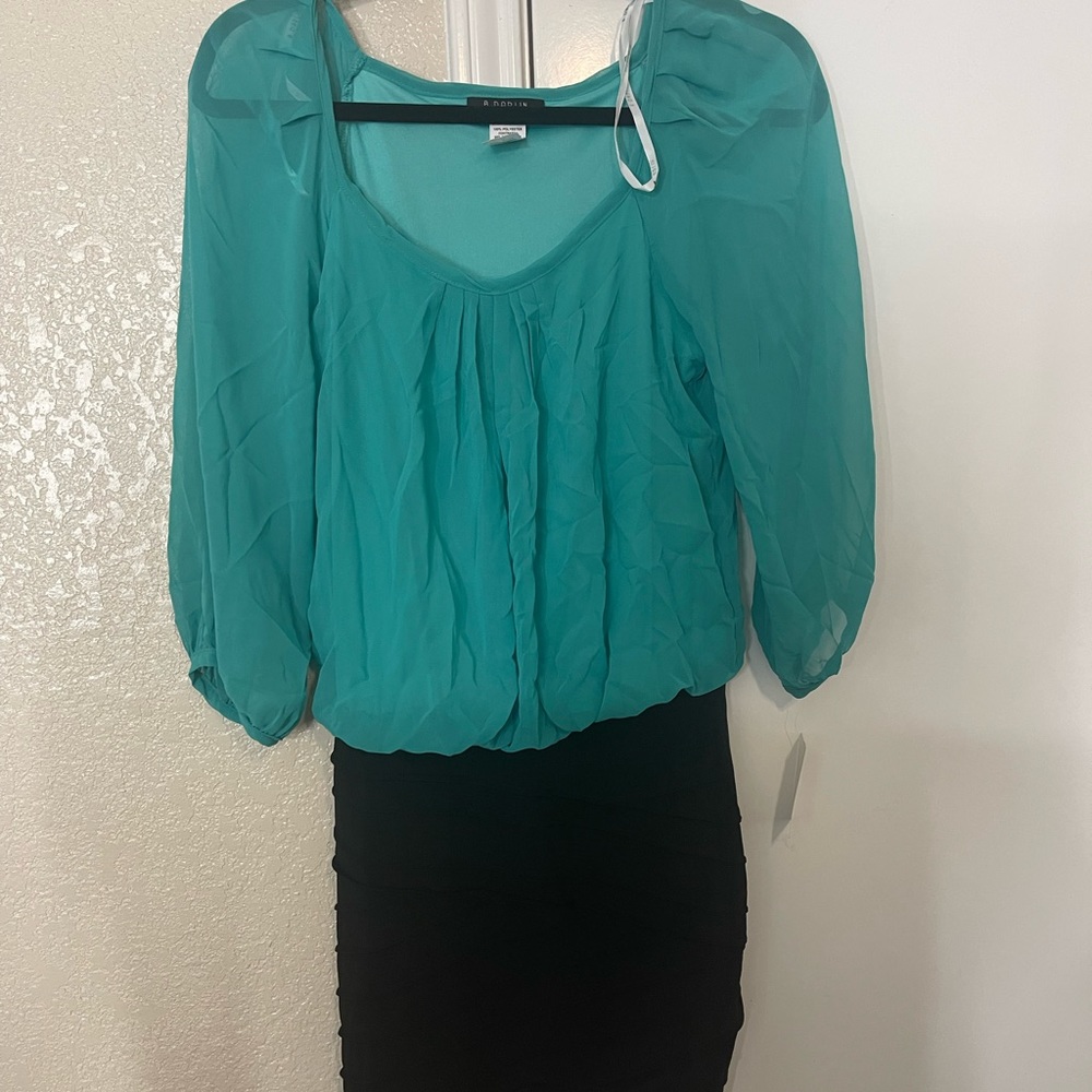 Green top black fitted bottom dress